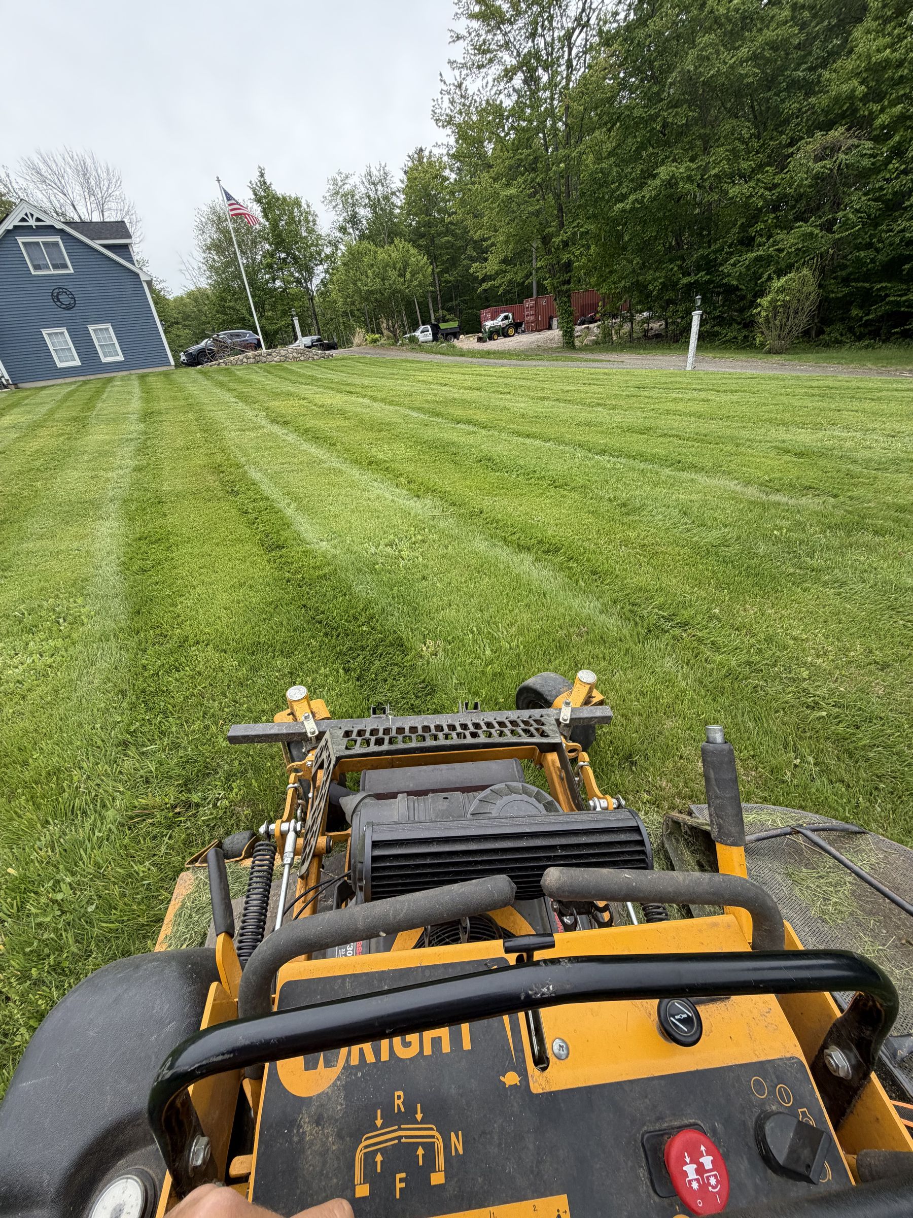 Mowing a freshly striped lawn